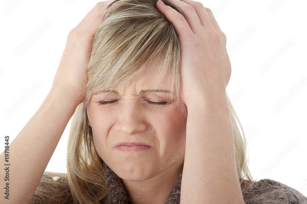 Woman with headache holding her hand to the head