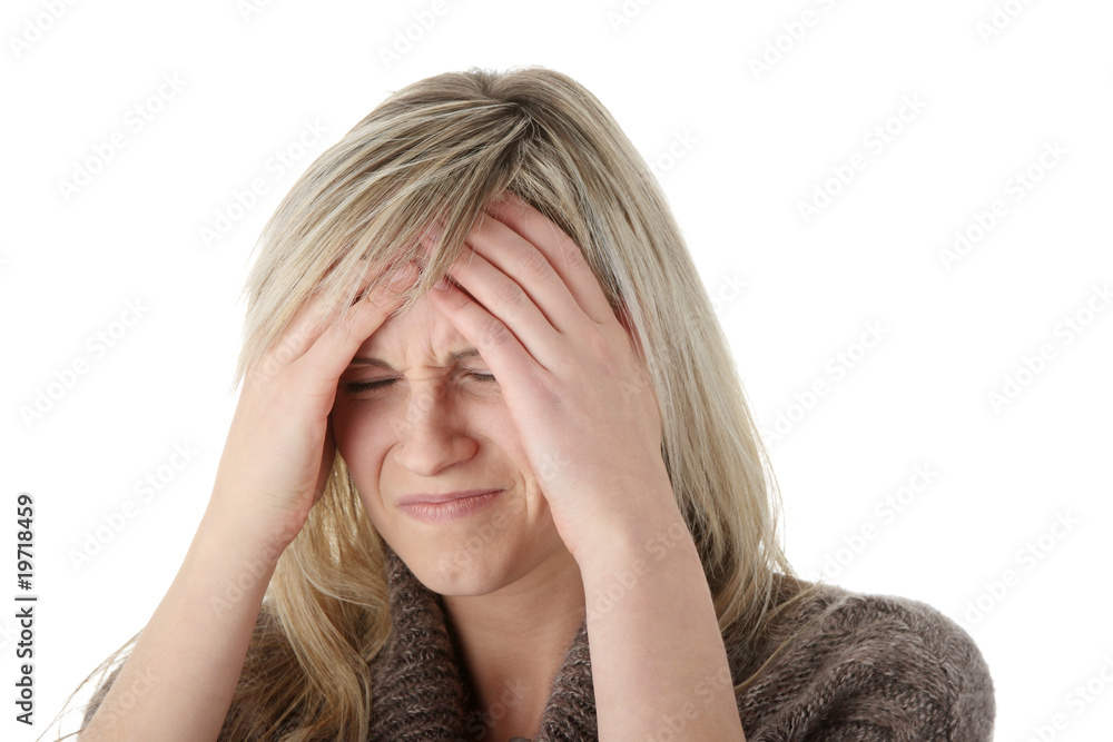 Woman with headache holding her hand to the head Woman with headache holding her hand to the head