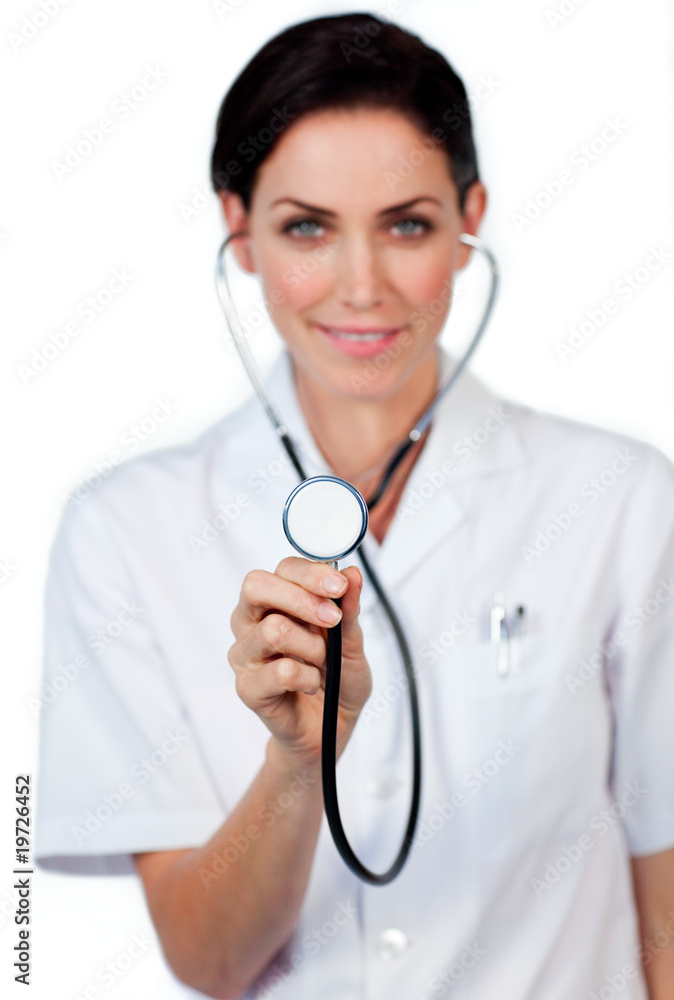 Smiling female doctor showing a stethoscope Smiling female doctor showing a stethoscope