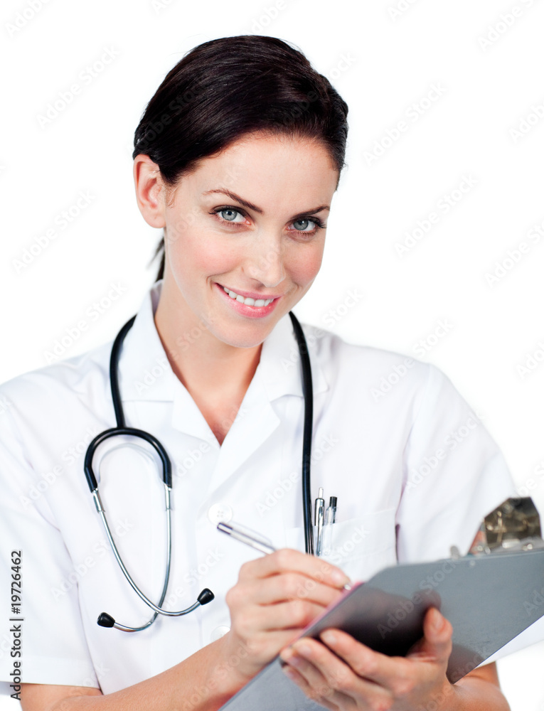 Smiling female doctor writing on a clipboard Smiling female doctor writing on a clipboard