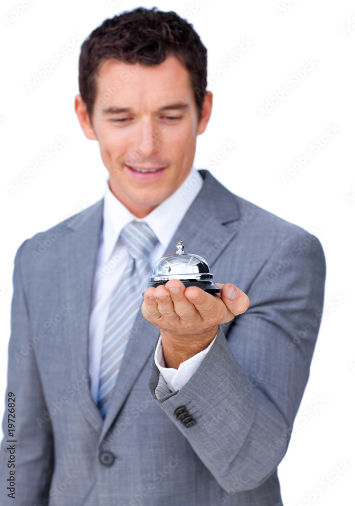 Attractive caucasian businessman showing a service bell Attractive caucasian businessman showing a service bell