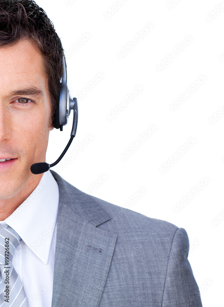 Close-up of a businessman using headset Close-up of a businessman using headset
