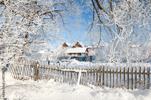 Winter day in the village. Country in winter.