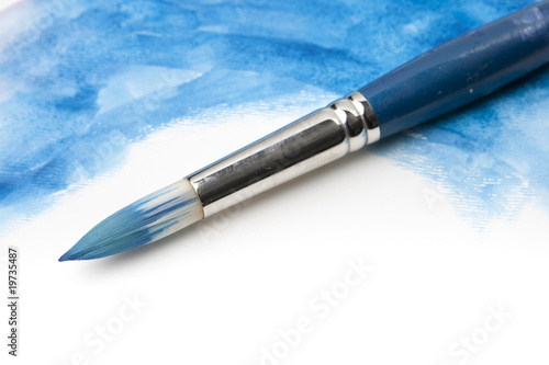 Watercolor Paintbrush on Painted Surface