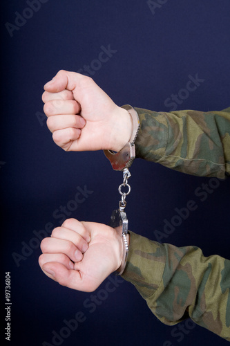 Hands in handcuffs