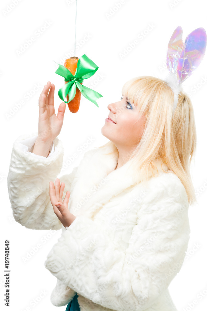 Woman in rabbit costume stretch out for carrot Woman in rabbit costume stretch out for carrot