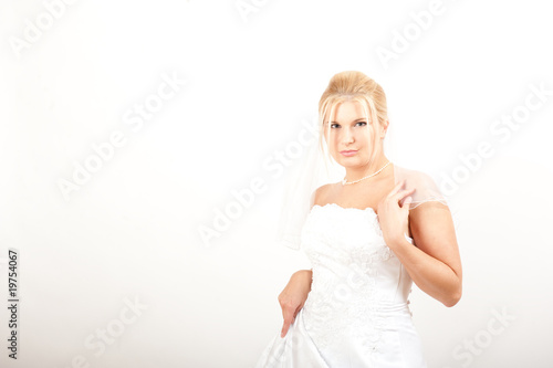 Young beautiful bride in white dress. copy-space photo