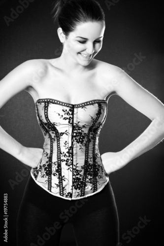 Smiling woman wearing a corset