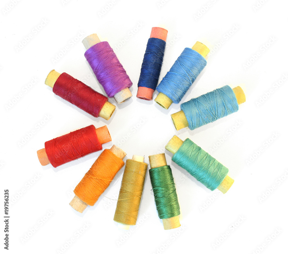 reels of color threads on white reels of color threads on white