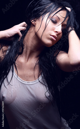 Print op canvas Young sexy girl in wet t-shirt