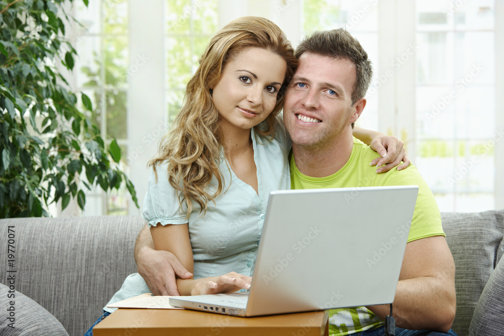 Couple using laptop computer Couple using laptop computer