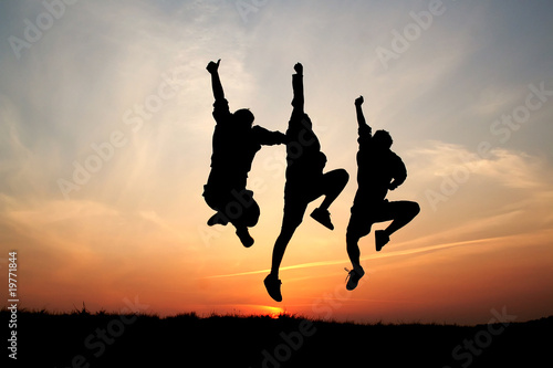 Silhouette of three men jumping 01