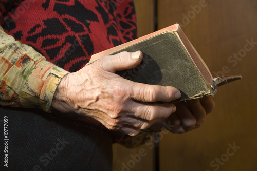 morning prayer of grandmother with the book