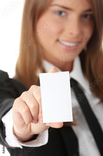 Beautiful young business woman with blank business card