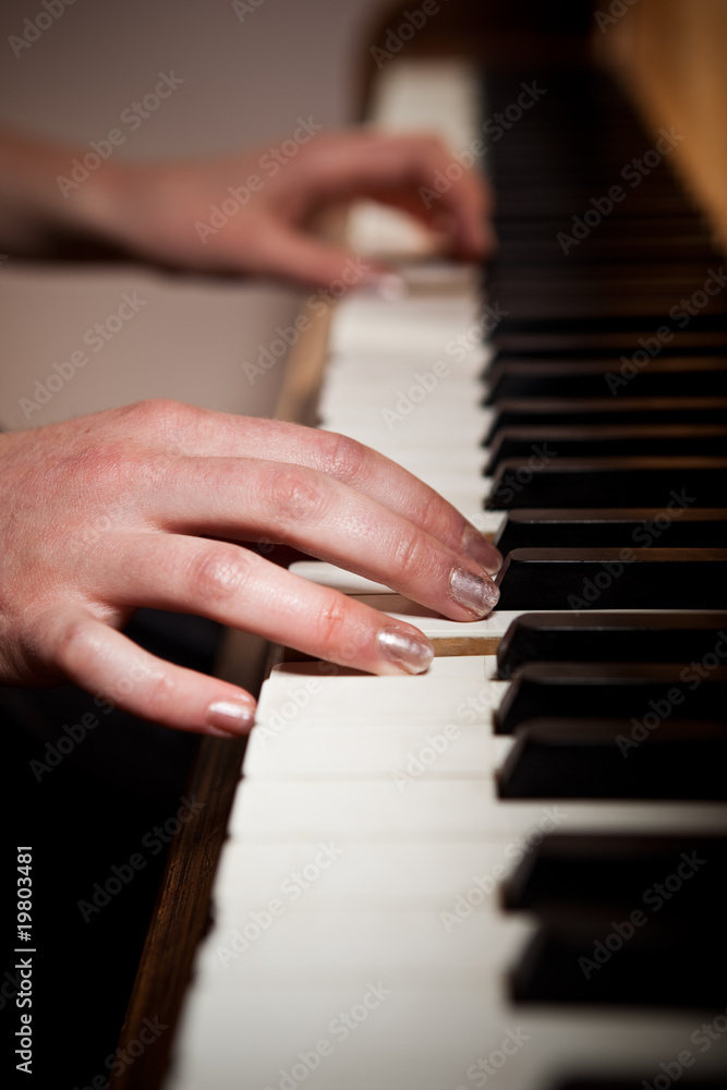 Fototapeta premium Woman playing piano