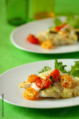 Baked fish fillet with tomato