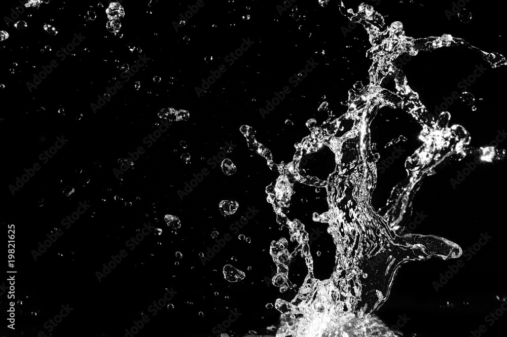 Stylish water splash. Isolated on black background . Stylish water splash. Isolated on black background .