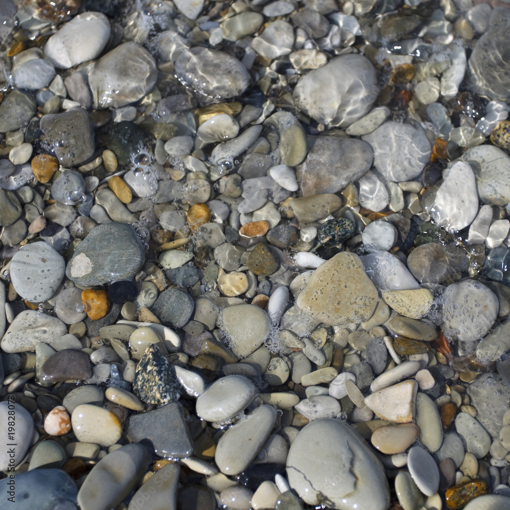 pebbles and stone in the sea water pebbles and stone in the sea water