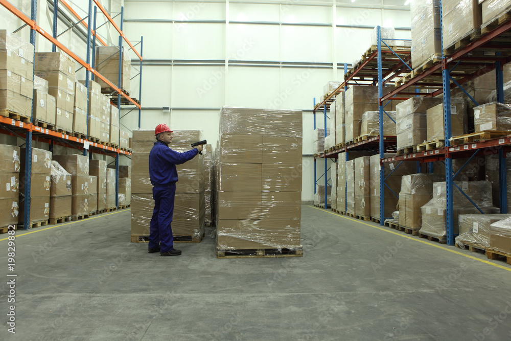 worker with bar code reader working in warehouse worker with bar code reader working in warehouse