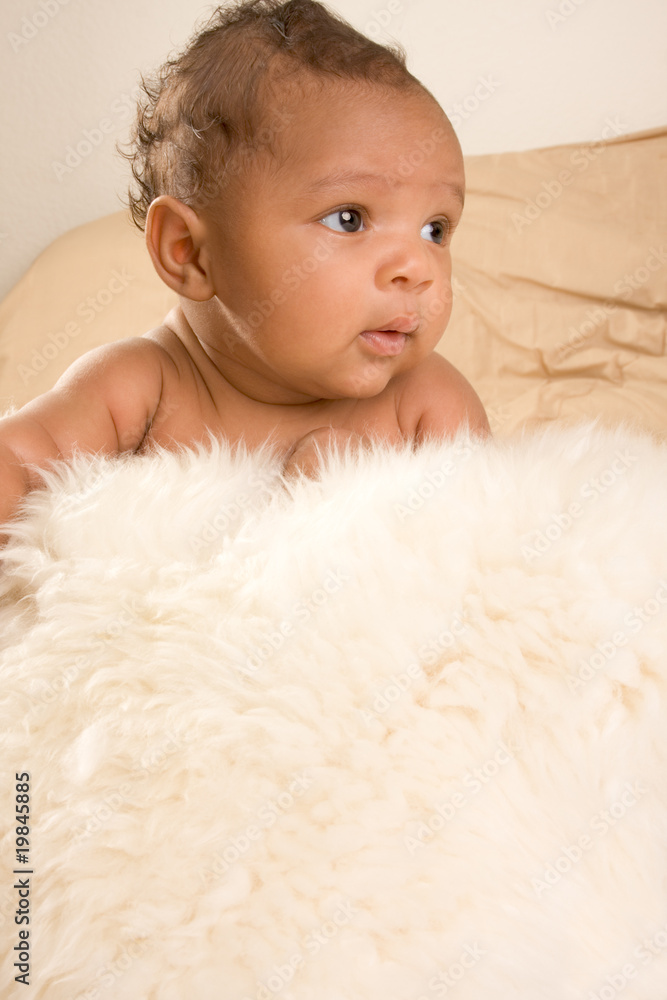 ethnic baby boy lying down on fur ethnic baby boy lying down on fur