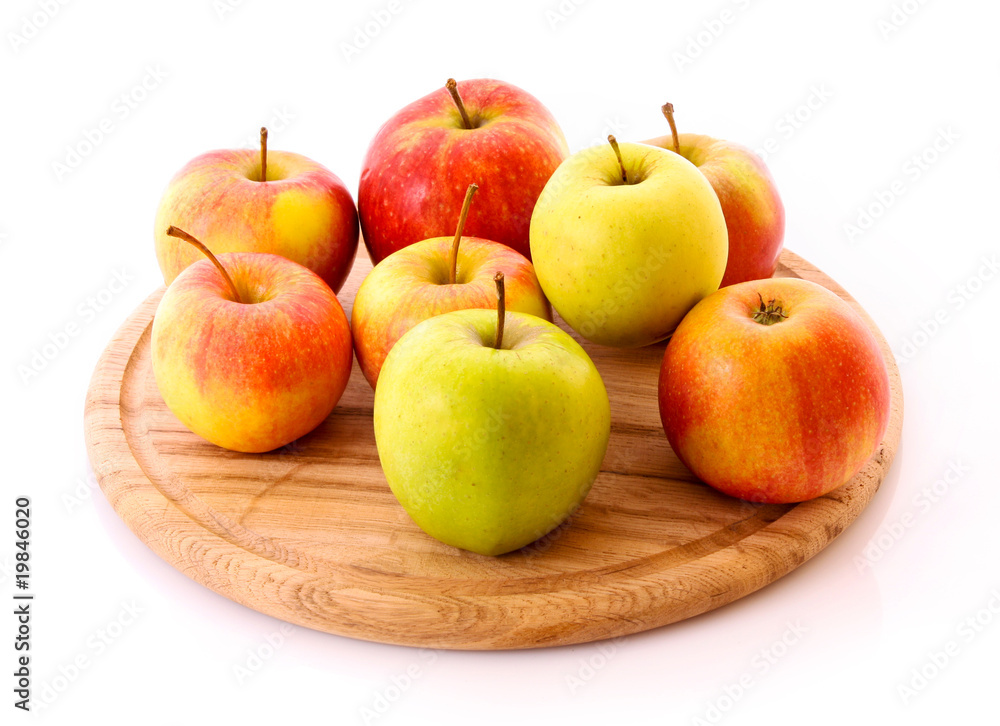 Few apples on wooden tray isolated on white Few apples on wooden tray isolated on white