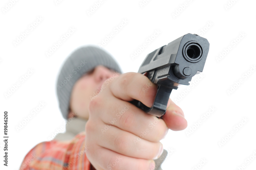 Young man is aiming with gun Young man is aiming with gun