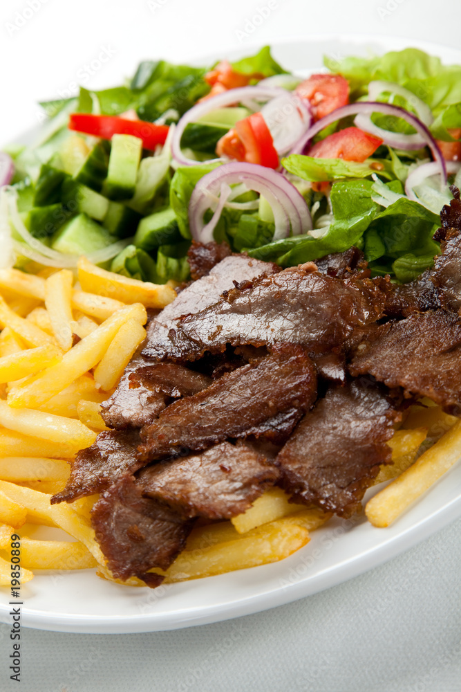 Grilled meat with fried potatoes and vegetables Grilled meat with fried potatoes and vegetables