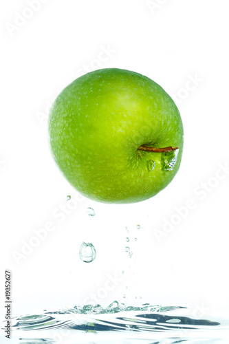 An apple jumping out of the water