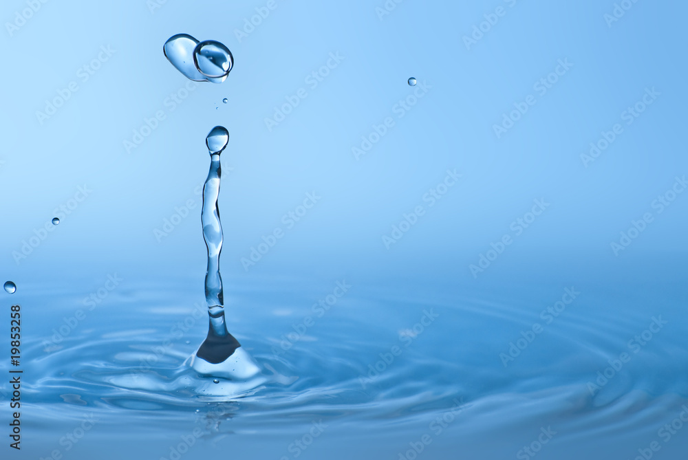 Clean blue drop of water splashing in clear water. Abstract blue Clean blue drop of water splashing in clear water. Abstract blue