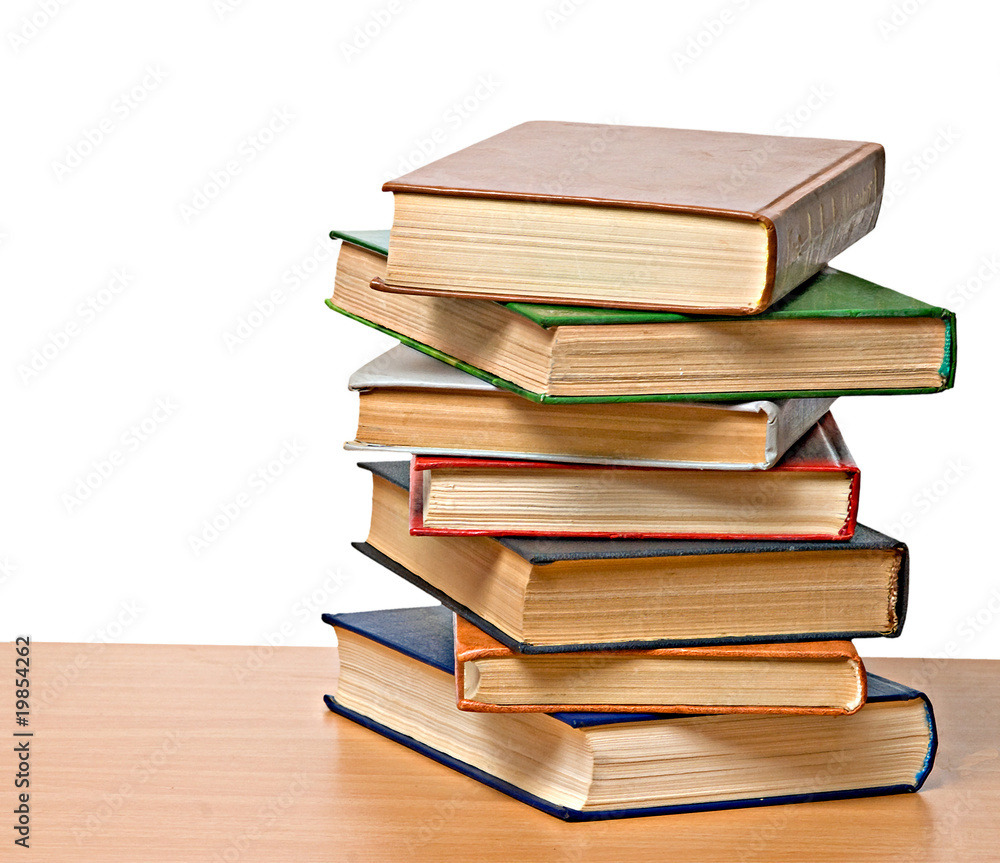 Pile of books  on desk
