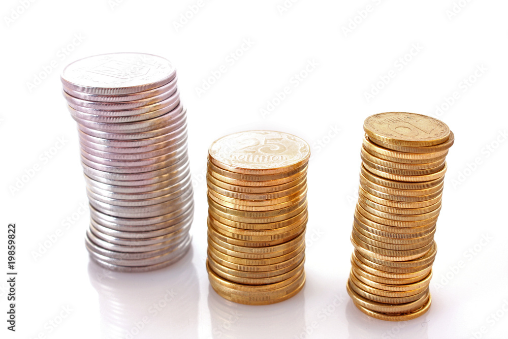 Few coin columns isolated on white Few coin columns isolated on white