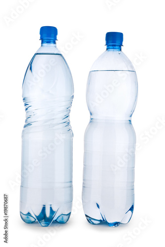 two blue transparent bottle with water isolated on a white backg