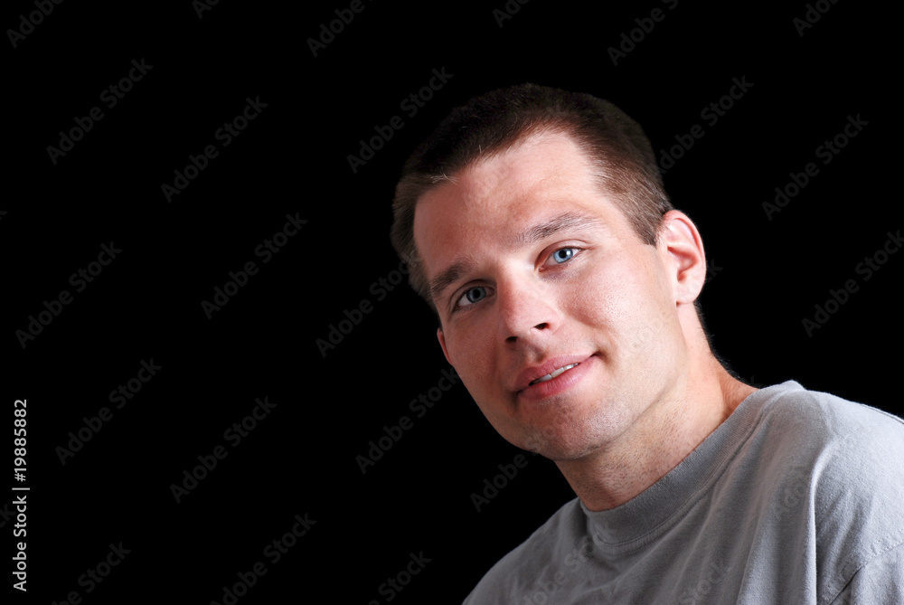 Young Man In Grey T Shirt On Black Young Man In Grey T Shirt On Black