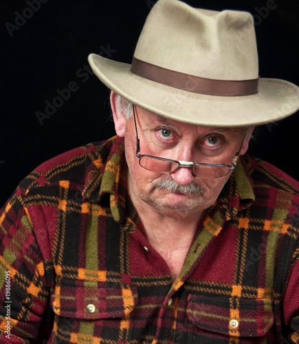 senior male with sad or grumpy face portrait