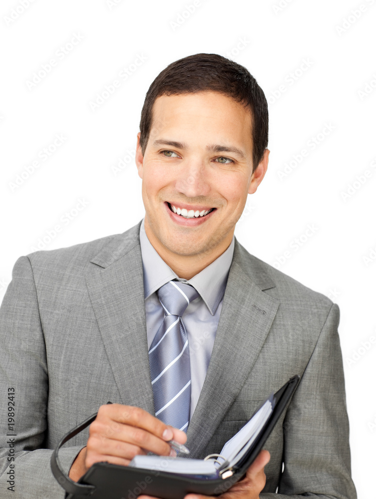 Attractive young businessman holding an agenda Attractive young businessman holding an agenda