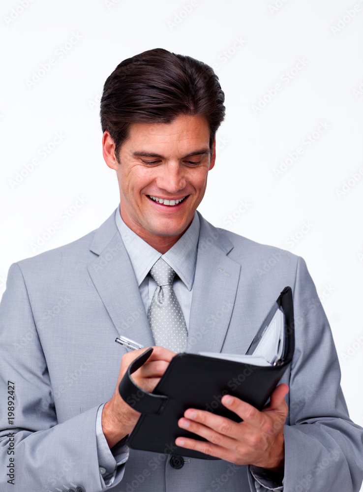 Smiling businessman holding an agenda Smiling businessman holding an agenda
