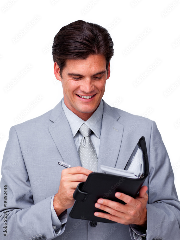 Confident businessman holding an agenda Confident businessman holding an agenda