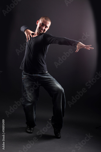 wacking man dancer against black background