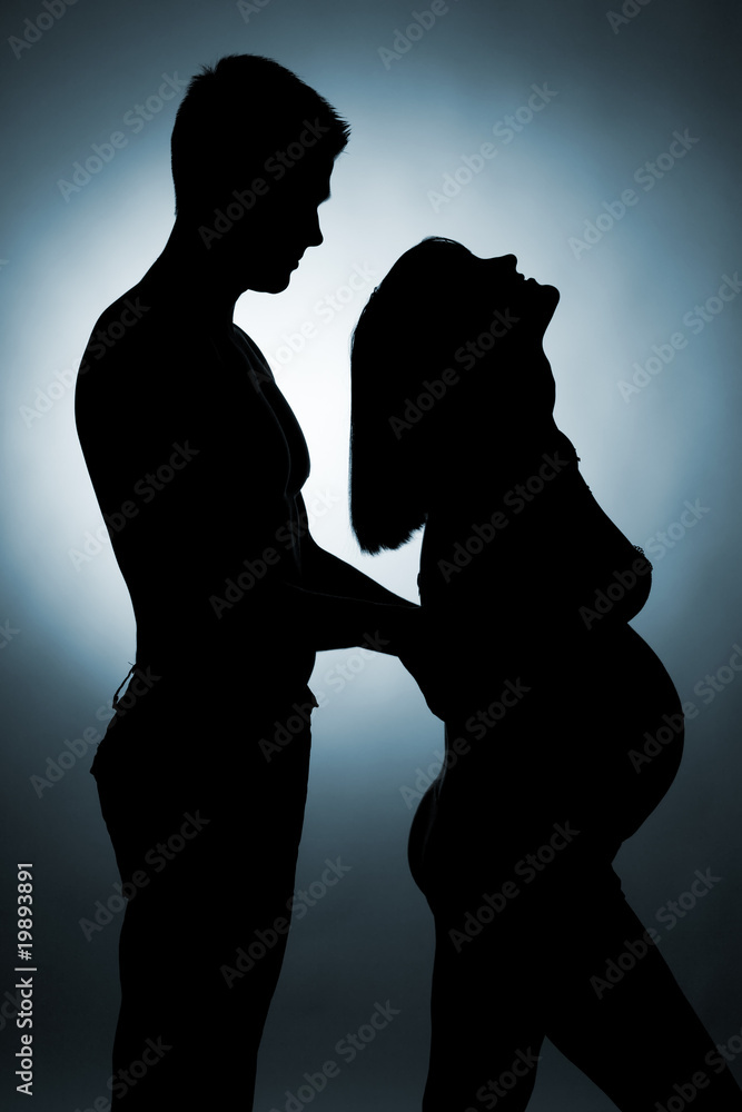 Silhouette of a young couple expecting a baby