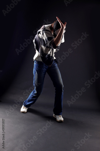 cool man modern dancer against black © konstantant