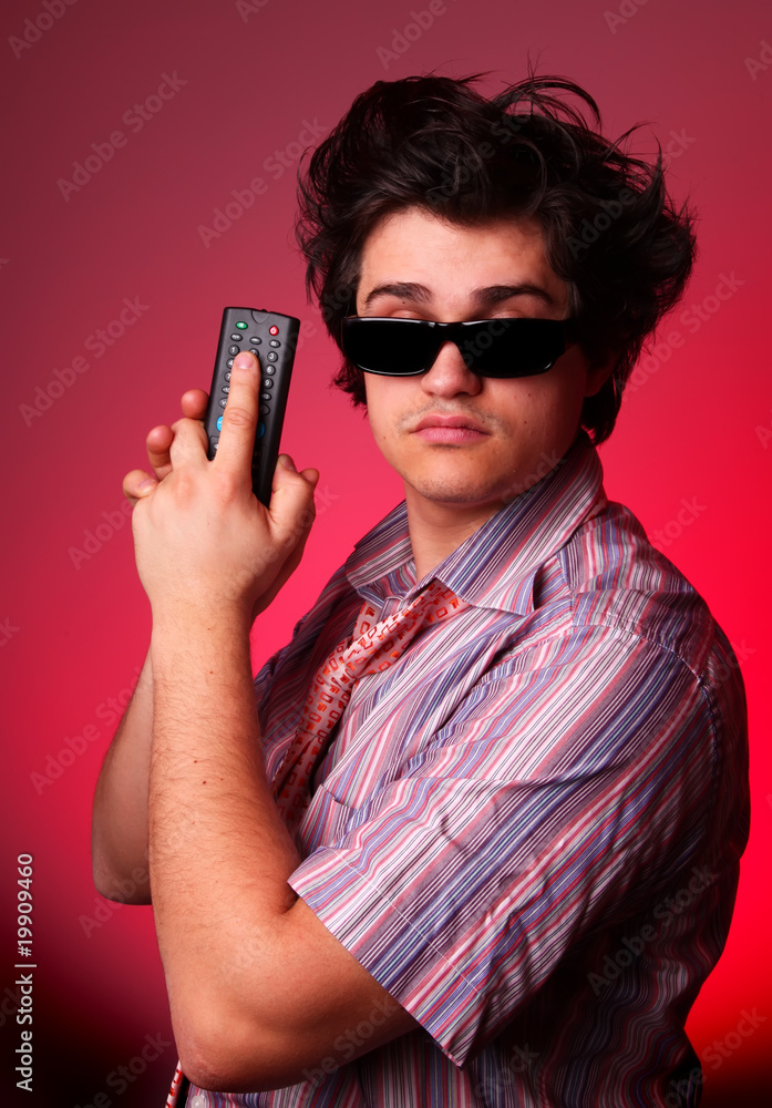 Fashion boy with TV remote control Fashion boy with TV remote control