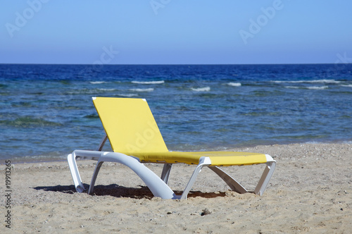 Fototapeta Naklejka Na Ścianę i Meble -  Chaise lounge on beach. sea and sand