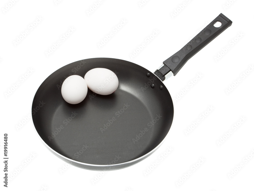A two eggs in a frying pan isolated A two eggs in a frying pan isolated
