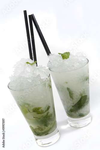 Mojito Rum cocktail on white background in highball tumbler.