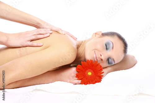 Attractive woman getting spa treatment isolated on white.