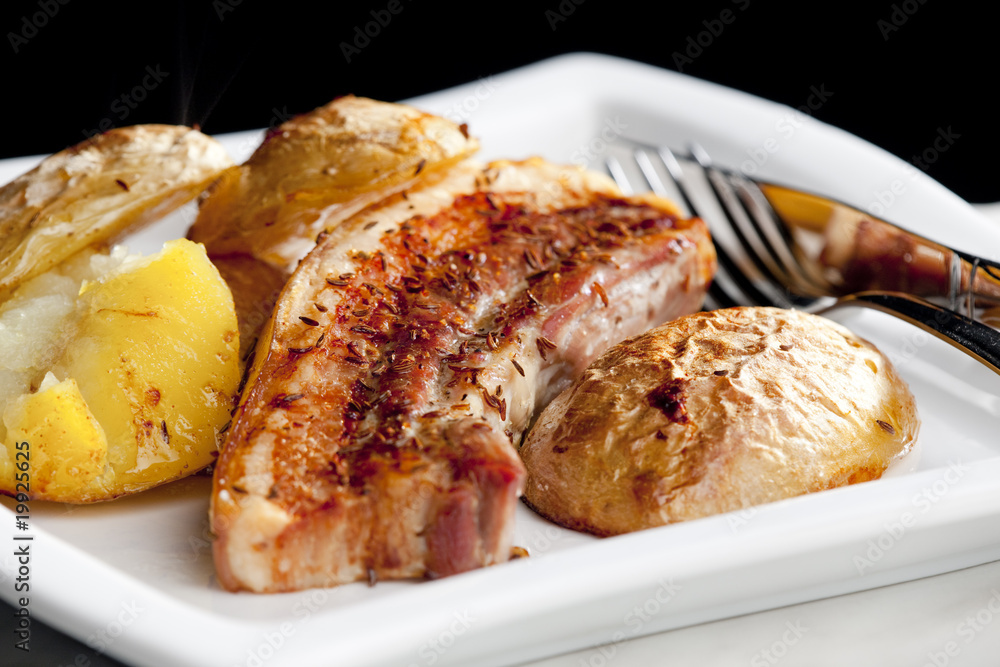 roasted pork meat with potatoes