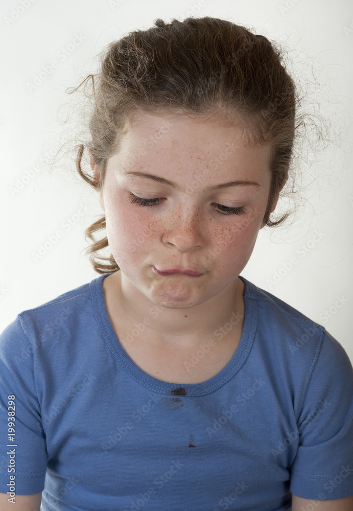 little girl showing a sad facial expression little girl showing a sad facial expression
