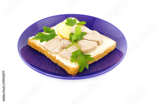 sandwich toast, cod liver, slices of lemon  isolated on white