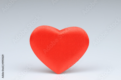Red heart  on grey background