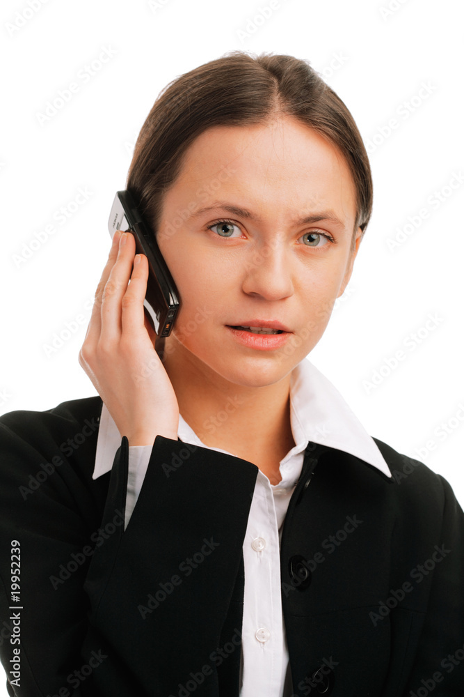 Serious businesswoman talking on mobile phone Serious businesswoman talking on mobile phone